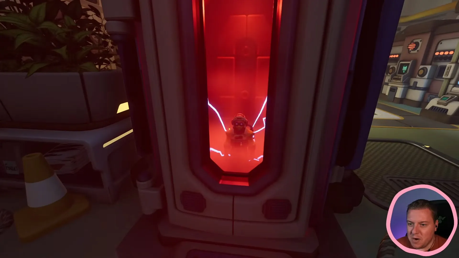 A player inside the red size-changing chamber